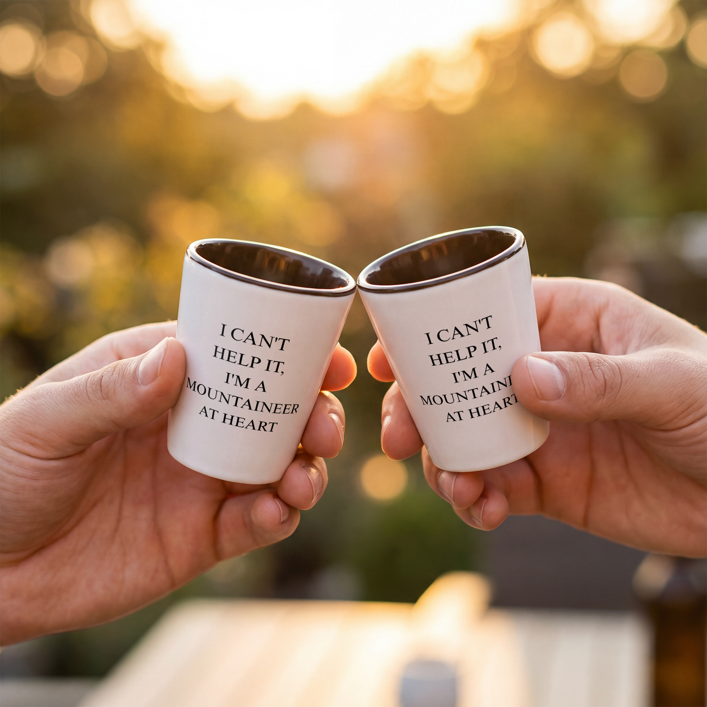 WV_Mountaineer_at_heart__shot_glass_Black_Lifestyle_01_Cheers_Mockup.png_15532705